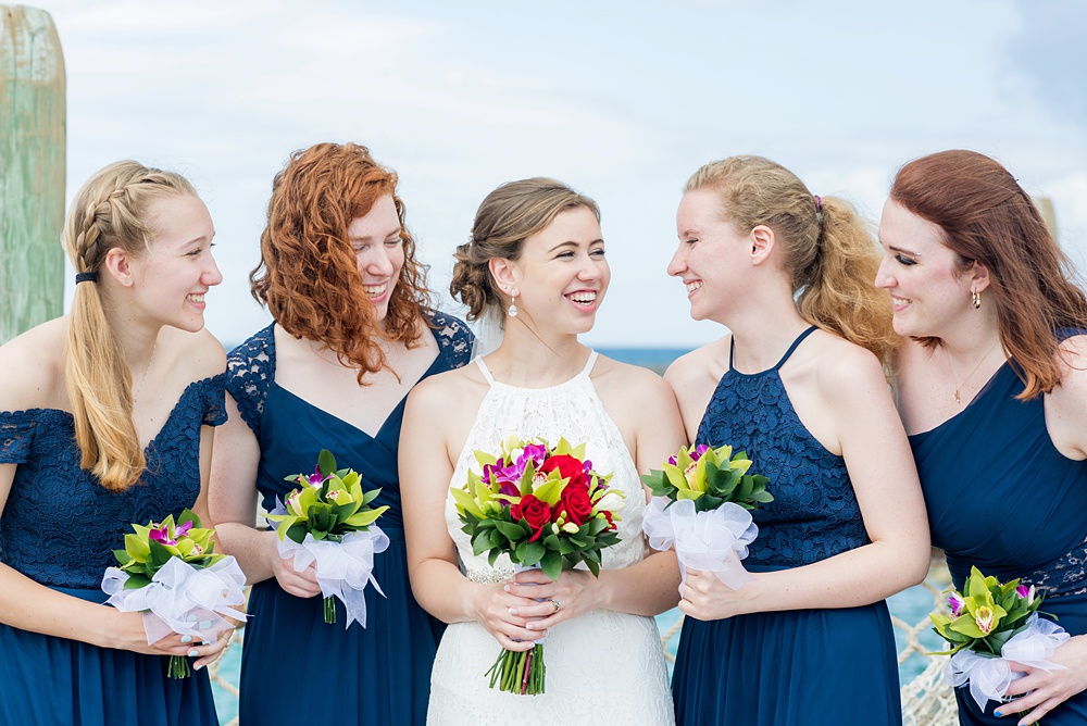 Disney Cruise Line destination wedding photos on Castaway Cay and the Disney Dream ship by Mikkel Paige Photography. This fairy tale wedding make the bride and groom's dream come true to get married in a fun location, spotlighting their love for the brand. Their ceremony was on the beach with the ship in the distance and aqua water nearby in the Bahamas. #mikkelpaige #disneywedding #disneyfairytalewedding #disneycruiseline #disneycruiselinewedding #disneydream #cruisewedding