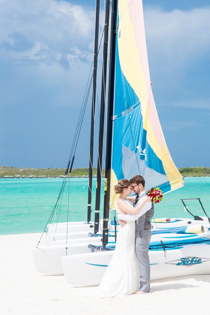 Disney Cruise Line destination wedding photos on Castaway Cay and the Disney Dream ship by Mikkel Paige Photography. This fairy tale wedding make the bride and groom's dream come true to get married in a fun location, spotlighting their love for the brand. Their ceremony was on the beach with the ship in the distance and aqua water nearby in the Bahamas. #mikkelpaige #disneywedding #disneyfairytalewedding #disneycruiseline #disneycruiselinewedding #disneydream #cruisewedding