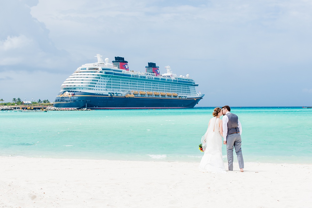 Disney Cruise Line destination wedding photos on Castaway Cay and the Disney Dream ship by Mikkel Paige Photography. This fairy tale wedding make the bride and groom's dream come true to get married in a fun location, spotlighting their love for the brand. Their ceremony was on the beach with the ship in the distance and aqua water nearby in the Bahamas. #mikkelpaige #disneywedding #disneyfairytalewedding #disneycruiseline #disneycruiselinewedding #disneydream #cruisewedding