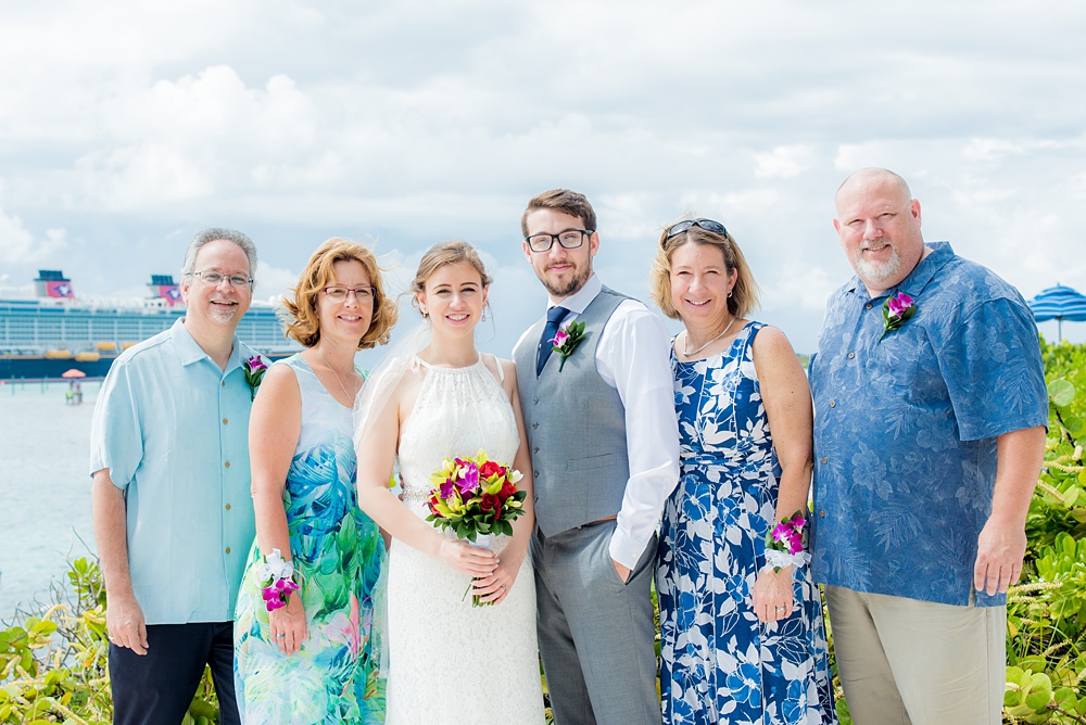 Disney Cruise Line destination wedding photos on Castaway Cay and the Disney Dream ship by Mikkel Paige Photography. This fairy tale wedding make the bride and groom's dream come true to get married in a fun location, spotlighting their love for the brand. Their ceremony was on the beach with the ship in the distance and aqua water nearby in the Bahamas. #mikkelpaige #disneywedding #disneyfairytalewedding #disneycruiseline #disneycruiselinewedding #disneydream #cruisewedding