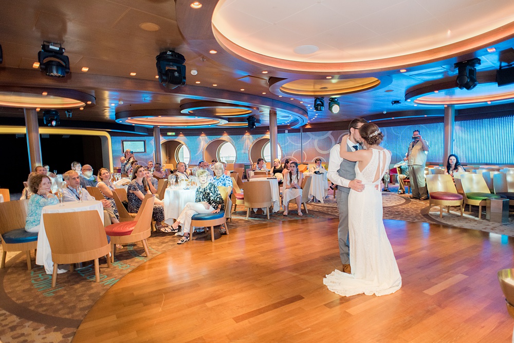 Disney Cruise Line destination wedding photos on Castaway Cay and the Disney Dream ship by Mikkel Paige Photography. This fairy tale wedding make the bride and groom's dream come true to get married in a fun location, spotlighting their love for the brand. Their reception was in the D Lounge with Fairy Tale Celebration champagne and a white fondant cake. #mikkelpaige #disneywedding #disneyfairytalewedding #disneycruiseline #disneycruiselinewedding #disneydream #cruisewedding