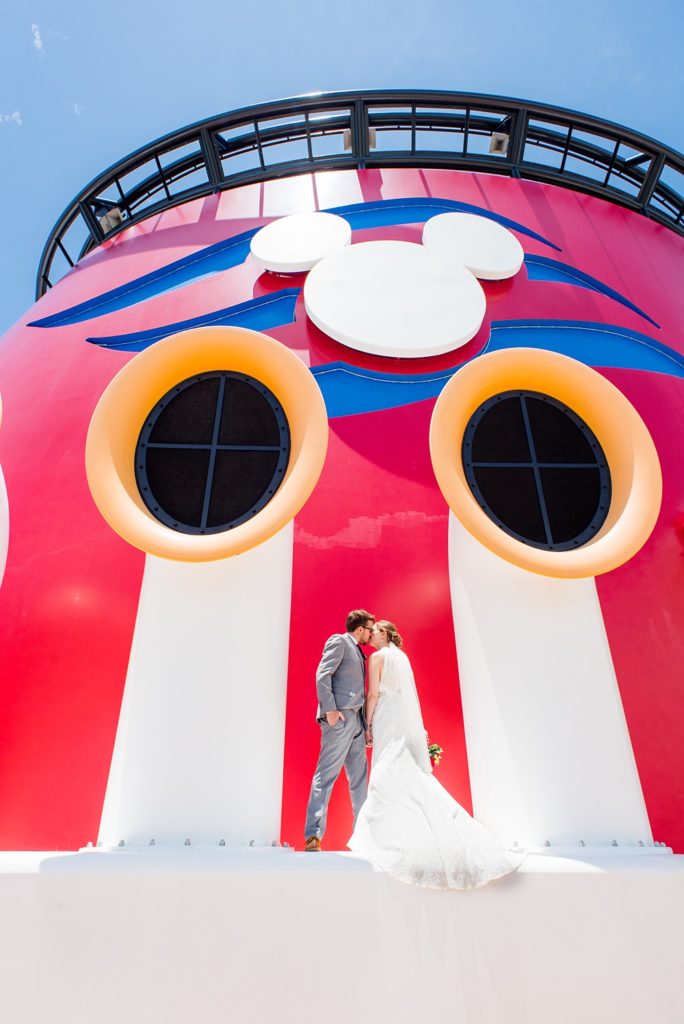 Disney Cruise Line destination wedding photos on Castaway Cay and the Disney Dream ship by Mikkel Paige Photography. This fairy tale wedding make the bride and groom's dream come true to get married in a fun location, spotlighting their love for the brand. #mikkelpaige #disneywedding #disneyfairytalewedding #disneycruiseline #disneycruiselinewedding #disneydream #cruisewedding