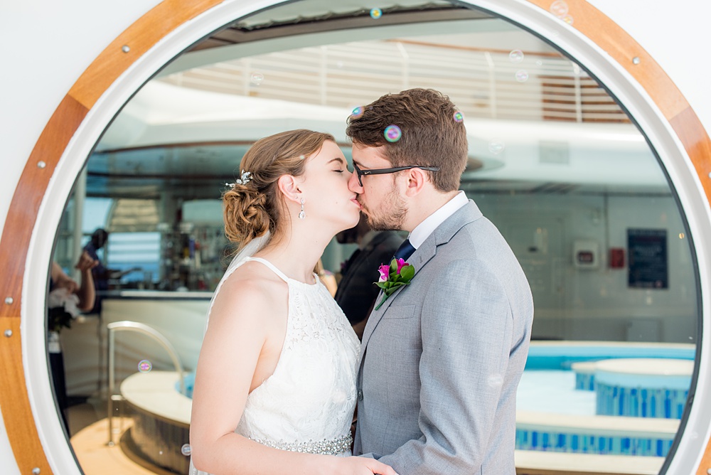 Disney Cruise Line destination wedding photos on Castaway Cay and the Disney Dream ship by Mikkel Paige Photography. This fairy tale wedding make the bride and groom's dream come true to get married in a fun location, spotlighting their love for the brand. #mikkelpaige #disneywedding #disneyfairytalewedding #disneycruiseline #disneycruiselinewedding #disneydream #cruisewedding #velvetringbox