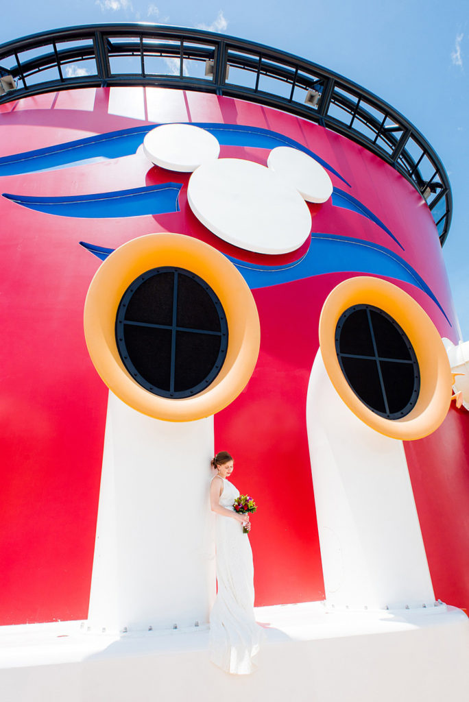 Disney Cruise Line destination wedding photos on Castaway Cay and the Disney Dream ship by Mikkel Paige Photography. This fairy tale wedding make the bride and groom's dream come true to get married in a fun location, spotlighting their love for the brand. #mikkelpaige #disneywedding #disneyfairytalewedding #disneycruiseline #disneycruiselinewedding #disneydream #cruisewedding