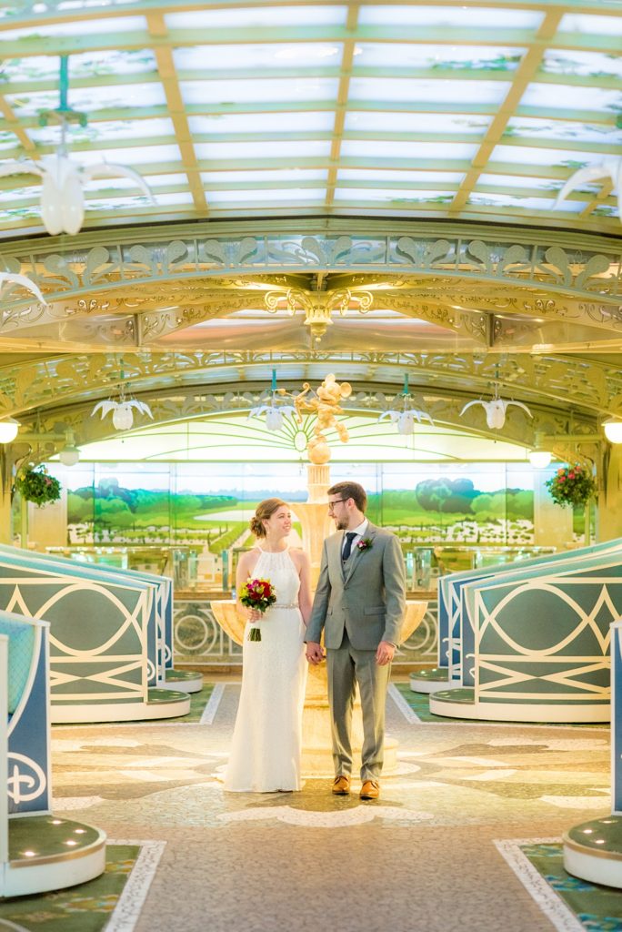 Disney Cruise Line destination wedding photos on Castaway Cay and the Disney Dream ship by Mikkel Paige Photography. This fairy tale wedding make the bride and groom's dream come true to get married in a fun location, spotlighting their love for the brand. Their ceremony was on the beach with the ship in the distance and aqua water nearby in the Bahamas. #mikkelpaige #disneywedding #disneyfairytalewedding #disneycruiseline #disneycruiselinewedding #disneydream #cruisewedding #velvetringbox