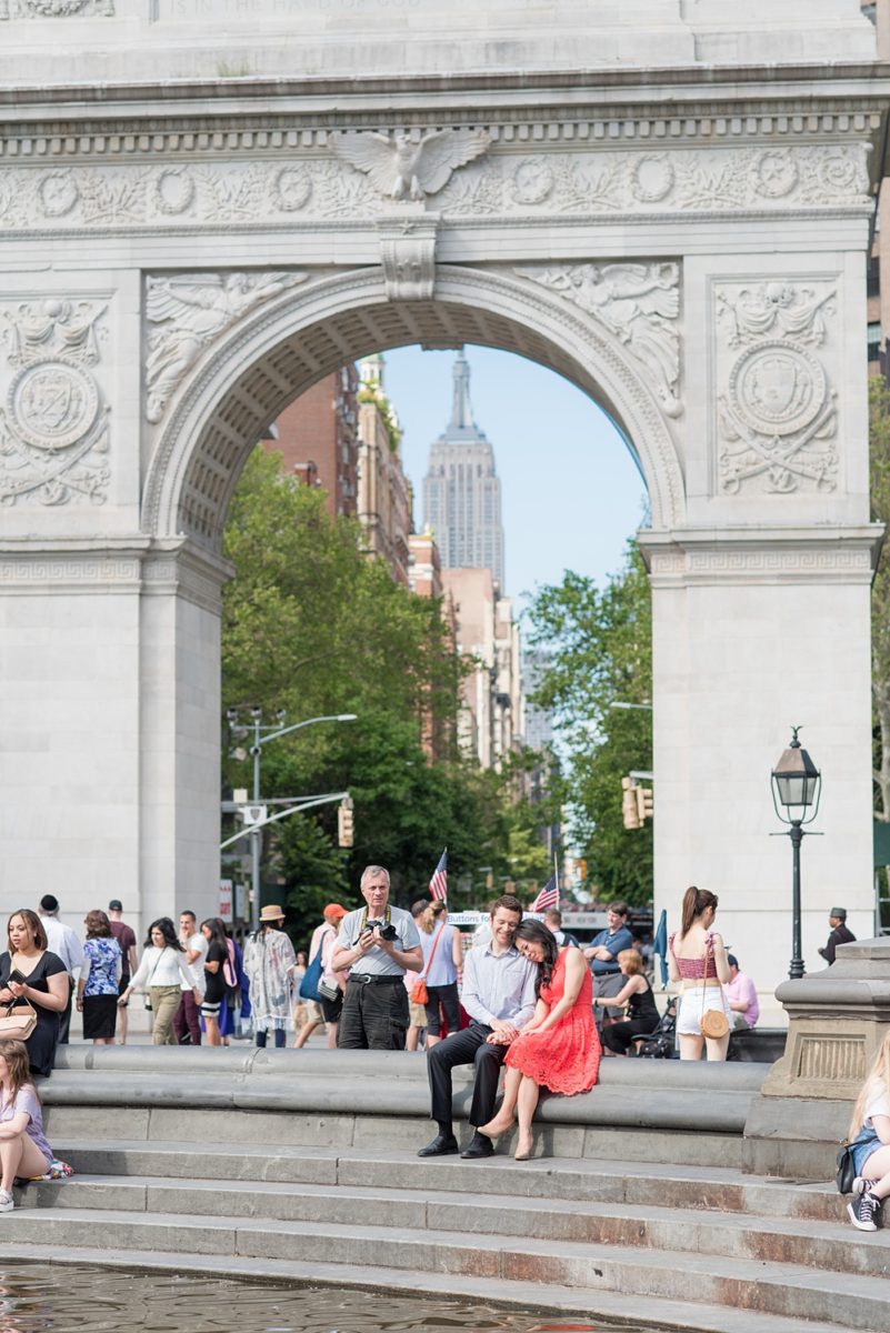 New York City pictures with a beautiful, fun couple with modern style. From a classic round diamond ring to sweet kisses with the Manhattan Skyline, Mikkel Paige Photography took them around western, lower NYC photographing their love at Google headquarters and Washington Square Park for engagement photos. #MikkelPaige #NYCengagementphotos #NewYorkCityEngagementPhotos #NYCengagementpictures