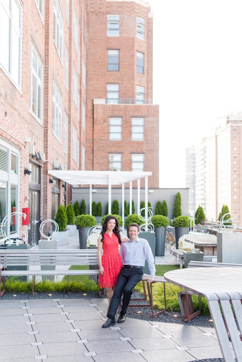 New York City pictures with a beautiful, fun couple with modern style. From a classic round diamond ring to sweet kisses with the Manhattan Skyline, Mikkel Paige Photography took them around western, lower NYC photographing their love at Google headquarters and Washington Square Park for engagement photos. #MikkelPaige #NYCengagementphotos #NewYorkCityEngagementPhotos #NYCengagementpictures