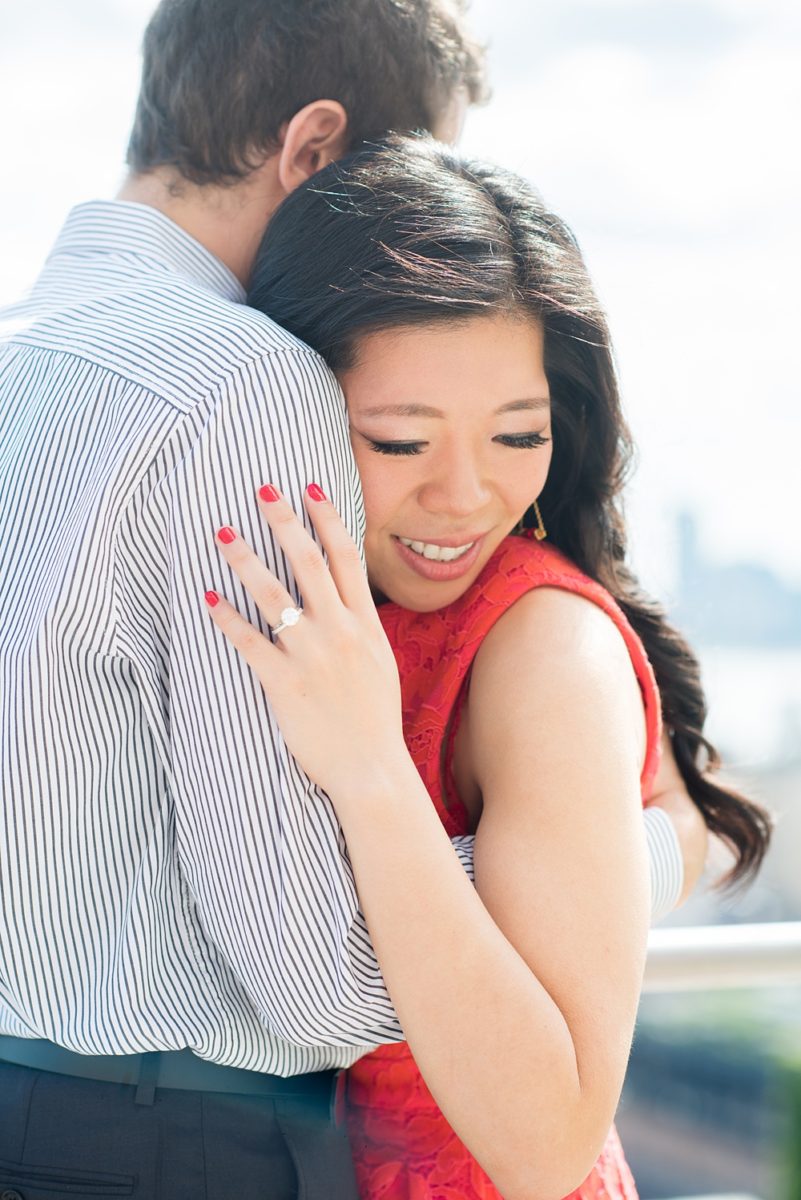 New York City pictures with a beautiful, fun couple with modern style. From a classic round diamond ring to sweet kisses with the Manhattan Skyline, Mikkel Paige Photography took them around western, lower NYC photographing their love at Google headquarters and Washington Square Park for engagement photos. #MikkelPaige #NYCengagementphotos #NewYorkCityEngagementPhotos #NYCengagementpictures