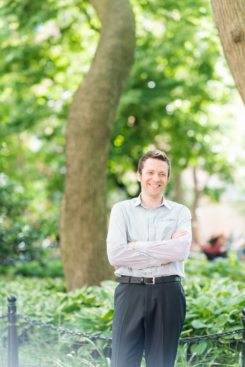 New York City pictures with a beautiful, fun couple with modern style. From a classic round diamond ring to sweet kisses with the Manhattan Skyline, Mikkel Paige Photography took them around western, lower NYC photographing their love at Google headquarters and Washington Square Park for engagement photos. #MikkelPaige #NYCengagementphotos #NewYorkCityEngagementPhotos #NYCengagementpictures