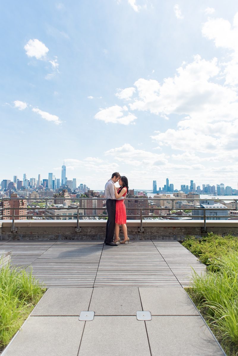 New York City pictures with a beautiful, fun couple with modern style. From a classic round diamond ring to sweet kisses with the Manhattan Skyline, Mikkel Paige Photography took them around western, lower NYC photographing their love at Google headquarters and Washington Square Park for engagement photos. #MikkelPaige #NYCengagementphotos #NewYorkCityEngagementPhotos #NYCengagementpictures