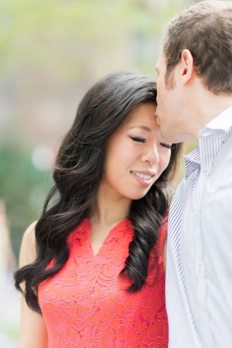 New York City pictures with a beautiful, fun couple with modern style. From a classic round diamond ring to sweet kisses with the Manhattan Skyline, Mikkel Paige Photography took them around western, lower NYC photographing their love at Google headquarters and Washington Square Park for engagement photos. #MikkelPaige #NYCengagementphotos #NewYorkCityEngagementPhotos #NYCengagementpictures