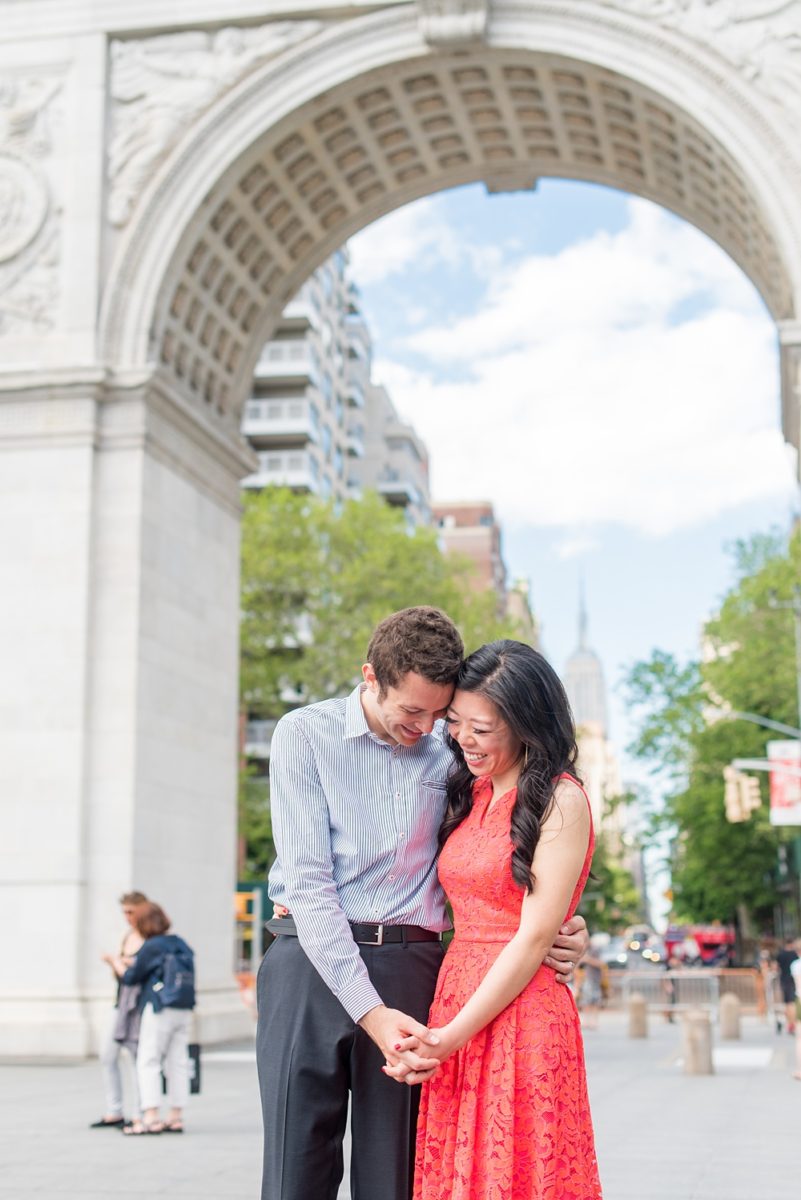 New York City pictures with a beautiful, fun couple with modern style. From a classic round diamond ring to sweet kisses with the Manhattan Skyline, Mikkel Paige Photography took them around western, lower NYC photographing their love at Google headquarters and Washington Square Park for engagement photos. #MikkelPaige #NYCengagementphotos #NewYorkCityEngagementPhotos #NYCengagementpictures