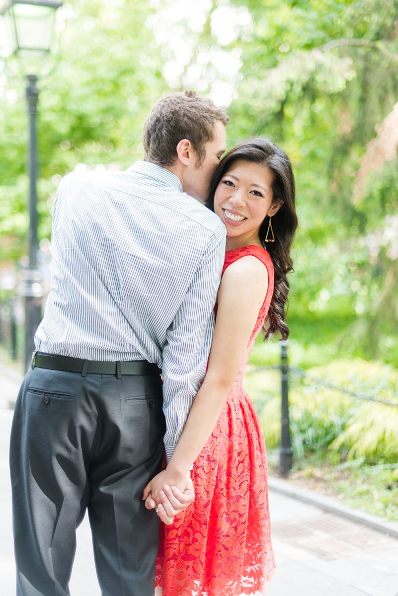 New York City pictures with a beautiful, fun couple with modern style. From a classic round diamond ring to sweet kisses with the Manhattan Skyline, Mikkel Paige Photography took them around western, lower NYC photographing their love at Google headquarters and Washington Square Park for engagement photos. #MikkelPaige #NYCengagementphotos #NewYorkCityEngagementPhotos #NYCengagementpictures