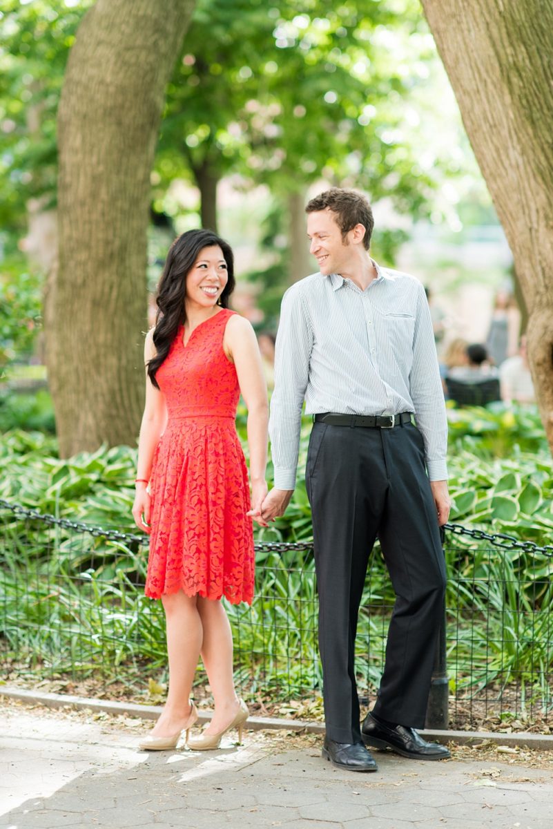 New York City pictures with a beautiful, fun couple with modern style. From a classic round diamond ring to sweet kisses with the Manhattan Skyline, Mikkel Paige Photography took them around western, lower NYC photographing their love at Google headquarters and Washington Square Park for engagement photos. #MikkelPaige #NYCengagementphotos #NewYorkCityEngagementPhotos #NYCengagementpictures