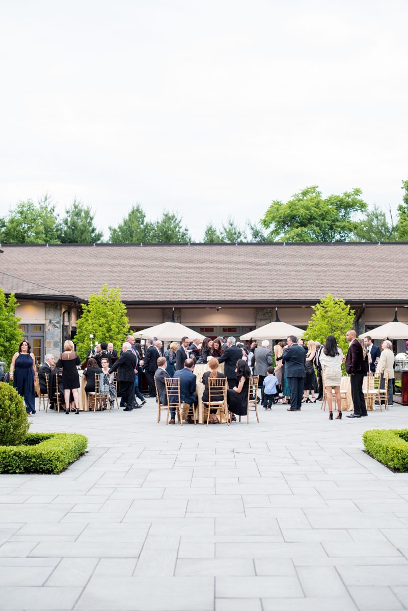 Photographs at New Jersey wedding venue, Temple Emanu-el, by Mikkel Paige Photography, with kosher catering for a golden 50th anniversary celebration. Decor with metallic and white flowers for the romantic space. Fun-loving couple providing beautiful inspiration with cute signs, table numbers and giveaways. All paper and signs by @suitepaperie. #mikkelpaige #newjerseyweddingphotographer #newjerseyweddingvenue #njweddings #njweddingphotographers