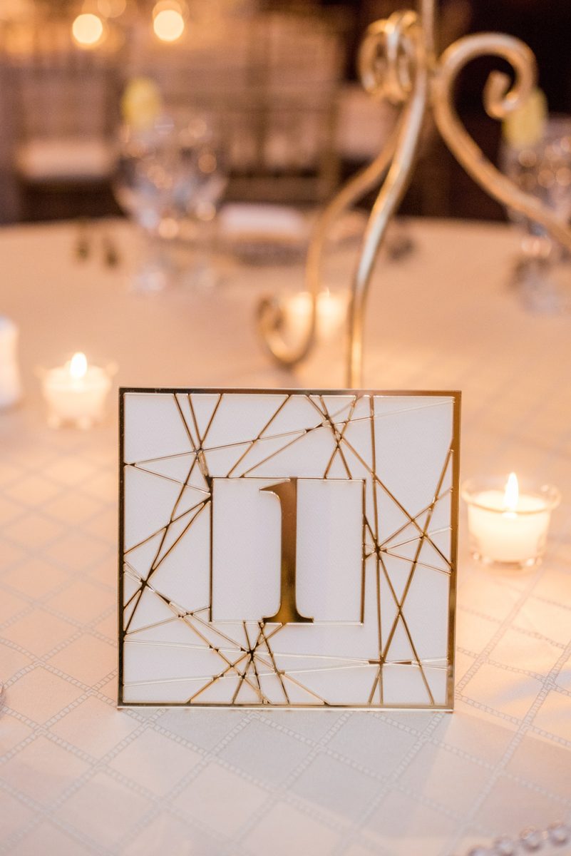 Photographs at New Jersey wedding venue, Temple Emanu-el, by Mikkel Paige Photography, with kosher catering for a golden 50th anniversary celebration. Decor with metallic and white flowers for the romantic space. Fun-loving couple providing beautiful inspiration with cute signs, table numbers and giveaways. All paper and signs by @suitepaperie. #mikkelpaige #newjerseyweddingphotographer #newjerseyweddingvenue #njweddings #njweddingphotographers