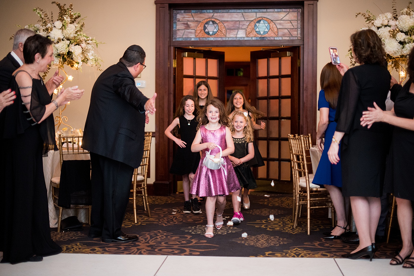 Photographs at New Jersey wedding venue, Temple Emanu-el, by Mikkel Paige Photography, with kosher catering for a golden 50th anniversary celebration. Decor with metallic and white flowers for the romantic space. Fun-loving couple providing beautiful inspiration with cute signs, table numbers and giveaways. All paper and signs by @suitepaperie. #mikkelpaige #newjerseyweddingphotographer #newjerseyweddingvenue #njweddings #njweddingphotographers