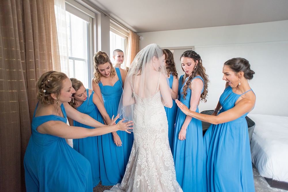 Pictures at a Durham, North Carolina wedding venue by Mikkel Paige Photography. The Rickhouse was a perfect indoor space for the bride and groom's ceremony + reception. They got ready at 21c Museum hotel and took beautiful outdoor photos in the summer sun. The couple chose fun yellow hues for the bouquets and a Carolina blue for beautiful bridesmaids gowns. #mikkelpaige #therickhouse #durhamweddingphotos #durhamwedding #northcarolinaweddingphotographer #durhamweddingphotographer #bluebridesmaids