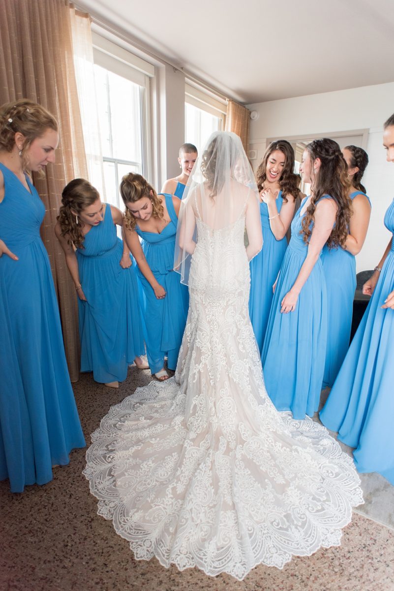 Pictures at a Durham, North Carolina wedding venue by Mikkel Paige Photography. The Rickhouse was a perfect indoor space for the bride and groom's ceremony + reception. They got ready at 21c Museum hotel and took beautiful outdoor photos in the summer sun. The couple chose fun yellow hues for the bouquets and a Carolina blue for beautiful bridesmaids gowns. #mikkelpaige #therickhouse #durhamweddingphotos #durhamwedding #northcarolinaweddingphotographer #durhamweddingphotographer #bluebridesmaids