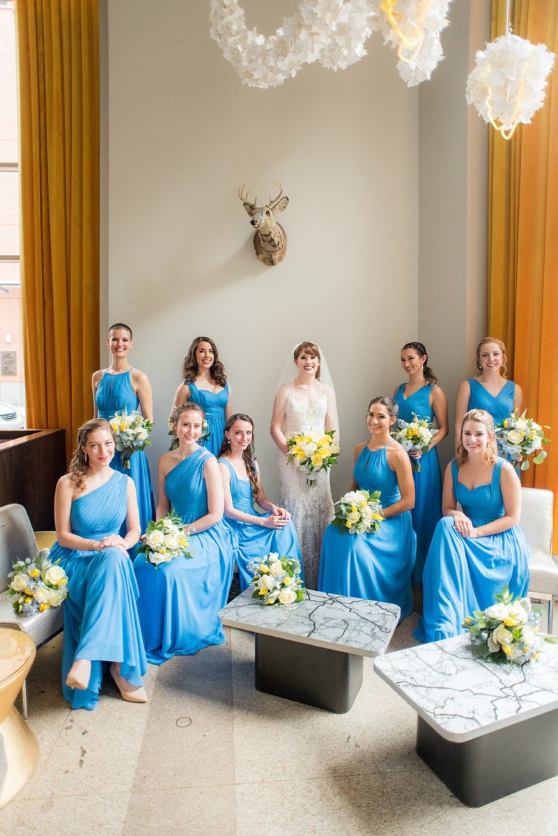 Pictures at a Durham, North Carolina wedding venue by Mikkel Paige Photography. The Rickhouse was a perfect indoor space for the bride and groom's ceremony + reception. They got ready at 21c Museum hotel and took beautiful outdoor photos in the summer sun. The couple chose fun yellow hues for the bouquets and a Carolina blue for beautiful bridesmaids gowns. #mikkelpaige #therickhouse #durhamweddingphotos #durhamwedding #northcarolinaweddingphotographer #durhamweddingphotographer #bluebridesmaids