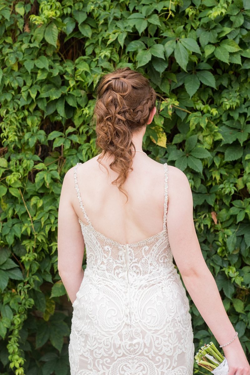 Pictures at a Durham, North Carolina wedding venue by Mikkel Paige Photography. The Rickhouse was the perfect indoor space for the bride and groom's ceremony + reception. They got ready at 21c Museum hotel and took beautiful outdoor photos in the summer sun. The bride chose yellow for her bouquet and a lace v-neck gown for her style. #mikkelpaige #therickhouse #durhamweddingphotos #durhamwedding #northcarolinaweddingphotographer #durhamweddingphotographer #blueandyellow #summerwedding #lacegown