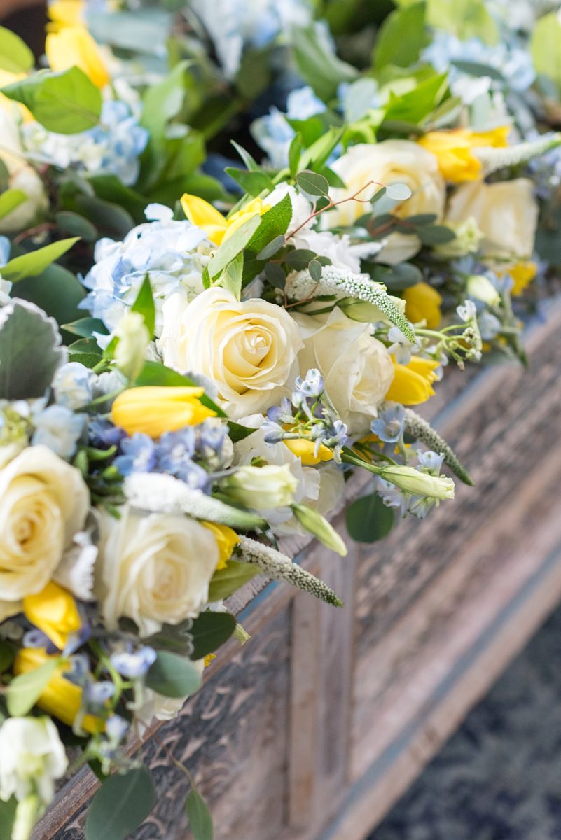 Pictures at a Durham, North Carolina wedding venue by Mikkel Paige Photography. The Rickhouse was the perfect indoor space for the bride and groom's ceremony + reception. They got ready at 21c Museum hotel and took beautiful outdoor photos in the summer sun. The bride chose yellow and blue for the decor including bridesmaids bouquets. #mikkelpaige #therickhouse #durhamweddingphotos #durhamwedding #northcarolinaweddingphotographer #durhamweddingphotographer #summerwedding #yellowbouquets