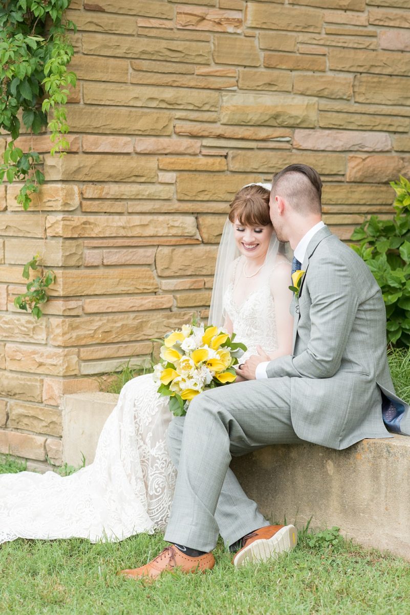 Pictures at a Durham, North Carolina wedding venue by Mikkel Paige Photography. The Rickhouse was the perfect indoor space for the bride and groom's ceremony and reception. They got ready at 21c Museum hotel and took beautiful outdoor photos in the summer sun. The couple chose fun yellow and blue colors for beautiful reception decor. #mikkelpaige #therickhouse #durhamweddingphotos #durhamwedding #northcarolinaweddingphotographer #durhamweddingphotographer #blueandyellow #summerwedding