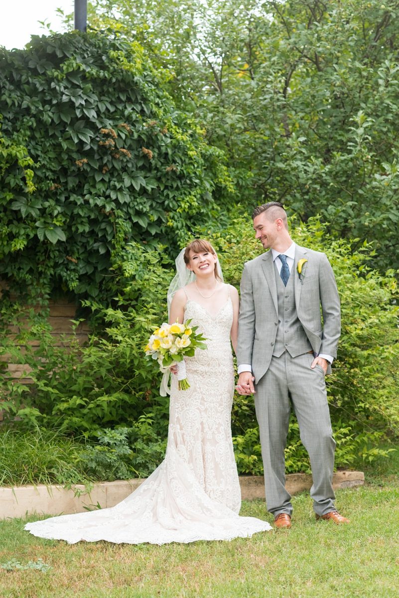 Pictures at a Durham, North Carolina wedding venue by Mikkel Paige Photography. The Rickhouse was the perfect indoor space for the bride and groom's ceremony and reception. They got ready at 21c Museum hotel and took beautiful outdoor photos in the summer sun. The couple chose fun yellow and blue colors for beautiful reception decor. #mikkelpaige #therickhouse #durhamweddingphotos #durhamwedding #northcarolinaweddingphotographer #durhamweddingphotographer #blueandyellow #summerwedding