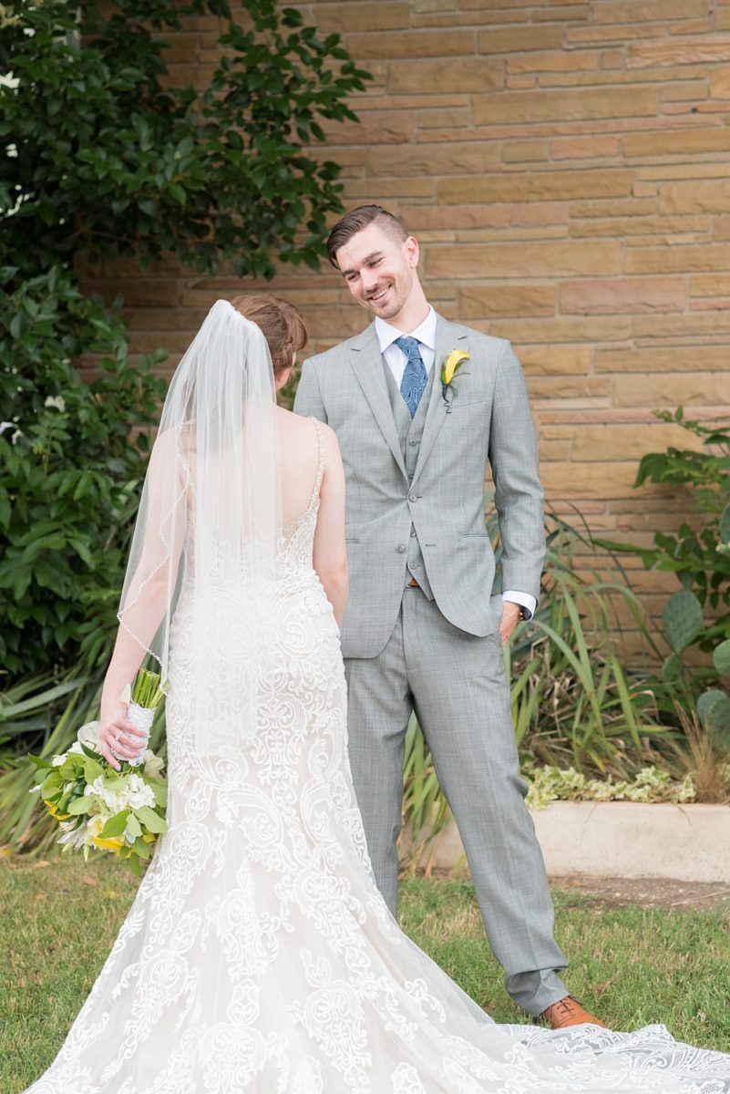 Pictures at a Durham, North Carolina wedding venue by Mikkel Paige Photography. The Rickhouse was the perfect indoor space for the bride and groom's ceremony and reception. They got ready at 21c Museum hotel and took beautiful outdoor photos in the summer sun. The couple chose fun yellow and blue colors for beautiful reception decor. #mikkelpaige #therickhouse #durhamweddingphotos #durhamwedding #northcarolinaweddingphotographer #durhamweddingphotographer #blueandyellow #summerwedding