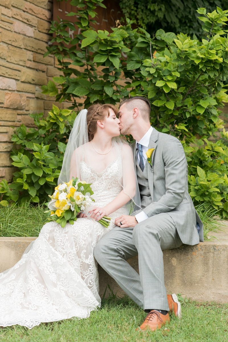 Pictures at a Durham, North Carolina wedding venue by Mikkel Paige Photography. The Rickhouse was the perfect indoor space for the bride and groom's ceremony and reception. They got ready at 21c Museum hotel and took beautiful outdoor photos in the summer sun. The couple chose fun yellow and blue colors for beautiful reception decor. #mikkelpaige #therickhouse #durhamweddingphotos #durhamwedding #northcarolinaweddingphotographer #durhamweddingphotographer #blueandyellow #summerwedding