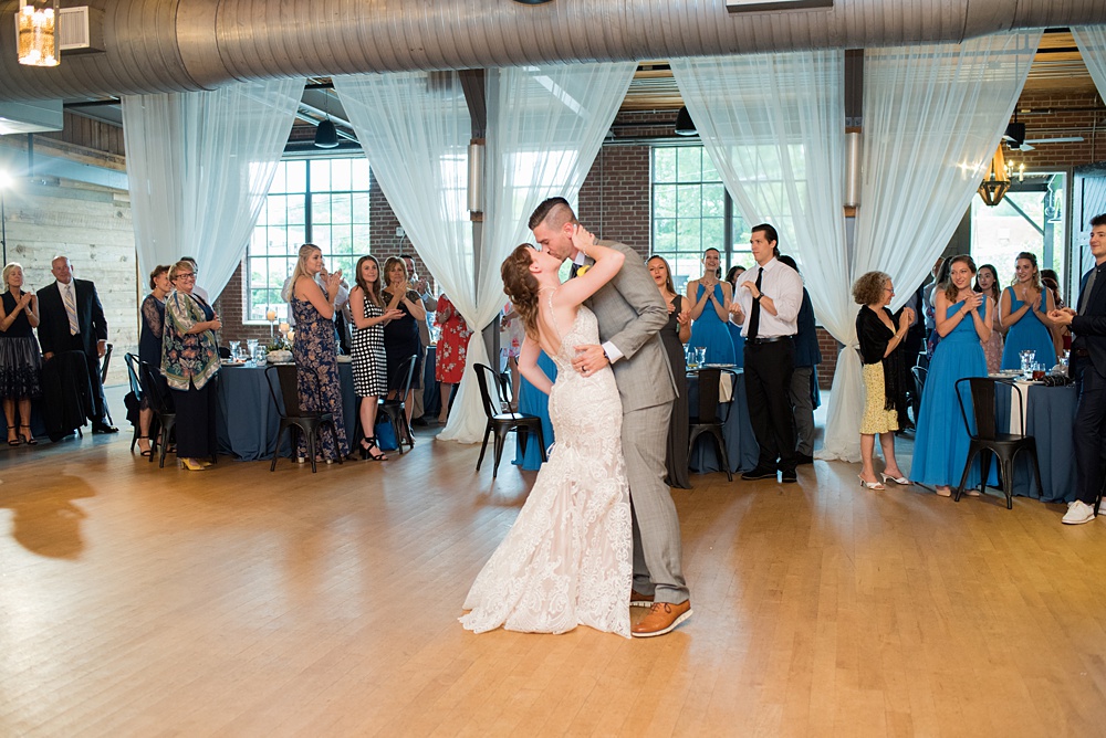 Pictures at a Durham, North Carolina wedding venue by Mikkel Paige Photography. The Rickhouse was the perfect outdoor/indoor space for the bride and groom's reception and ceremony. The couple chose fun yellow and blue colors for their summer decor. #mikkelpaige #therickhouse #durhamweddingphotos #durhamwedding #northcarolinaweddingphotographer #durhamweddingphotographer