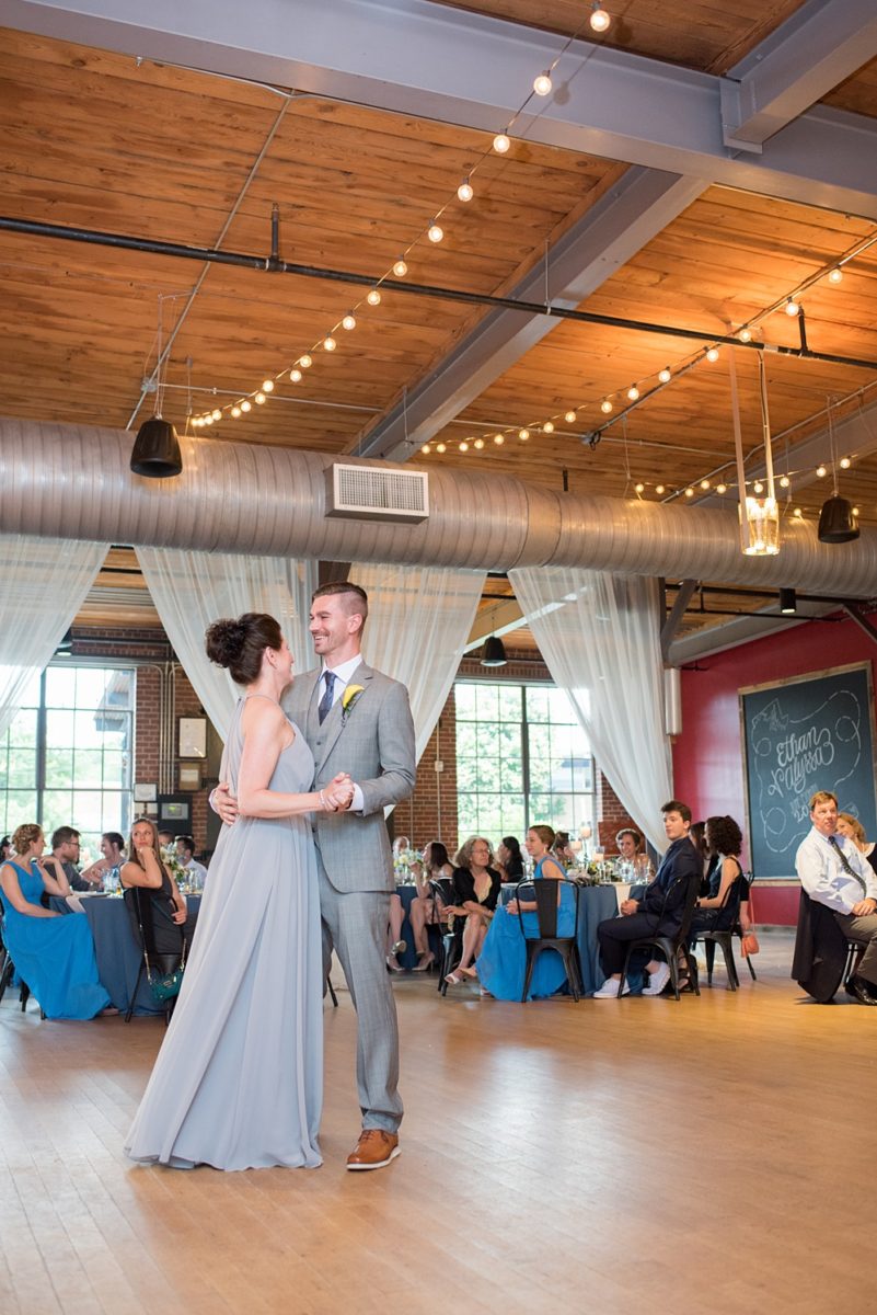 Pictures at a Durham, North Carolina wedding venue by Mikkel Paige Photography. The Rickhouse was the perfect outdoor/indoor space for the bride and groom's reception and ceremony. The couple chose fun yellow and blue colors for their summer decor. #mikkelpaige #therickhouse #durhamweddingphotos #durhamwedding #northcarolinaweddingphotographer #durhamweddingphotographer