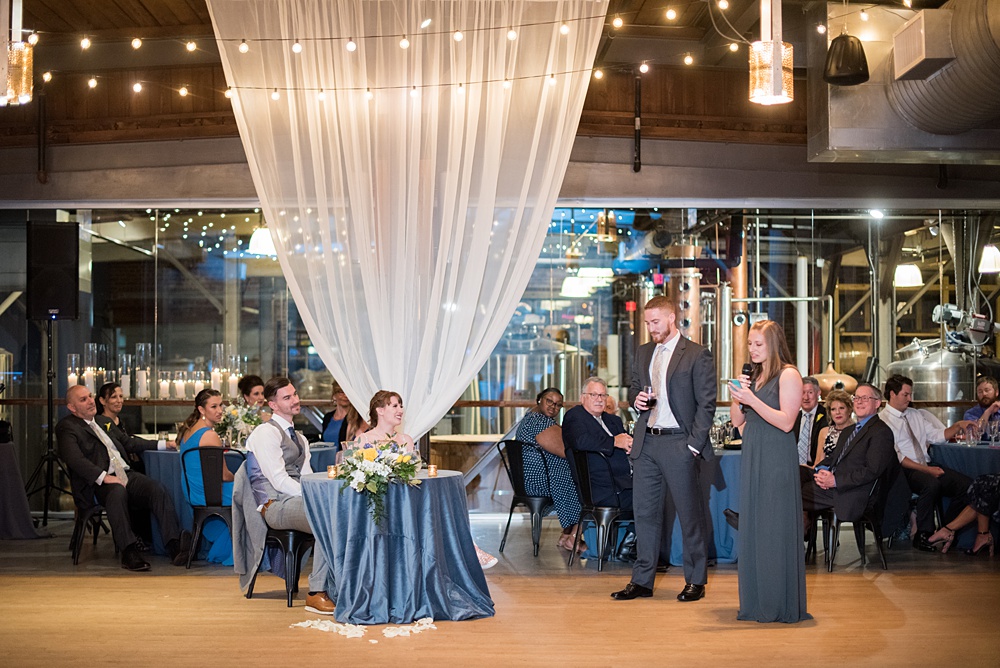 Pictures at a Durham, North Carolina wedding venue by Mikkel Paige Photography. The Rickhouse was the perfect outdoor/indoor space for the bride and groom's reception and ceremony. The couple chose fun yellow and blue colors for their summer decor. #mikkelpaige #therickhouse #durhamweddingphotos #durhamwedding #northcarolinaweddingphotographer #durhamweddingphotographer