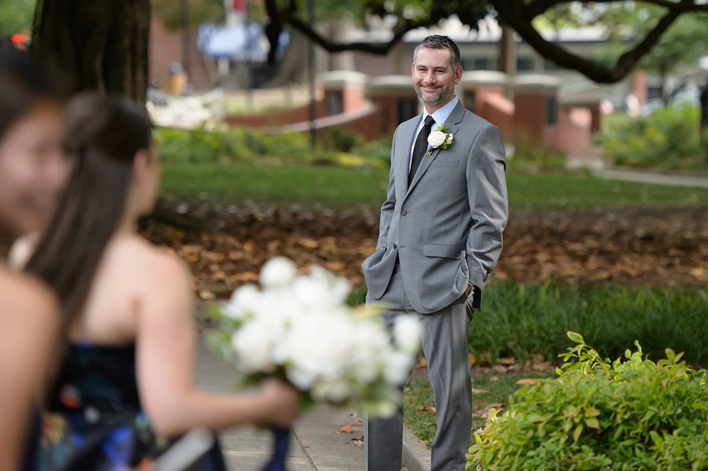 Mikkel Paige Photography's wedding photos - an elopement in downtown Raleigh, North Carolina - with a white bouquet by @meristemfloral, beauty by Wink Hair and Makeup and photos by Brian Mullins Photography.