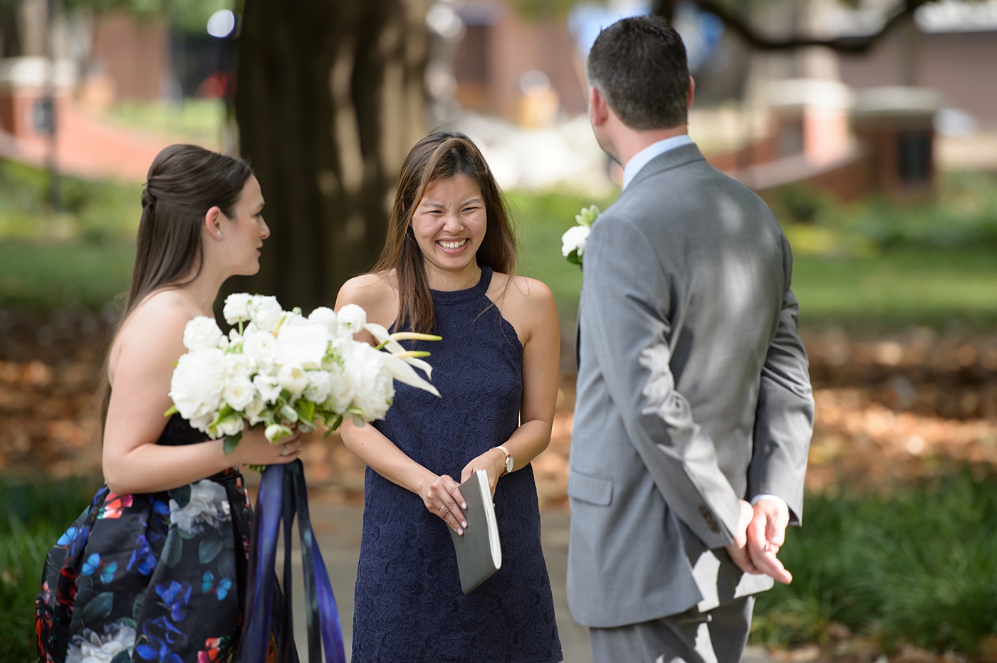 Mikkel Paige Photography's wedding photos - an elopement in downtown Raleigh, North Carolina - with a white bouquet by @meristemfloral, beauty by Wink Hair and Makeup and photos by Brian Mullins Photography.