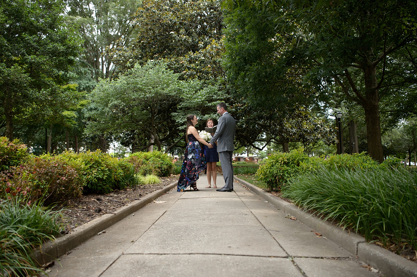 Mikkel Paige Photography's wedding photos - an elopement in downtown Raleigh, North Carolina - with a white bouquet by @meristemfloral, beauty by Wink Hair and Makeup and photos by Brian Mullins Photography.