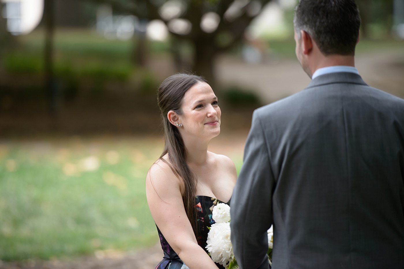 Mikkel Paige Photography's wedding photos - an elopement in downtown Raleigh, North Carolina - with a white bouquet by @meristemfloral, beauty by Wink Hair and Makeup and photos by Brian Mullins Photography.