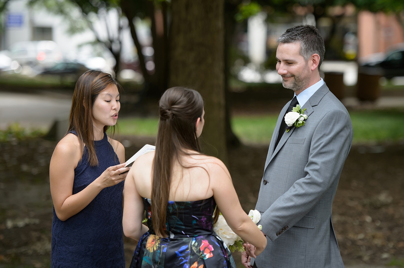 Mikkel Paige Photography's wedding photos - an elopement in downtown Raleigh, North Carolina - with a white bouquet by @meristemfloral, beauty by Wink Hair and Makeup and photos by Brian Mullins Photography.