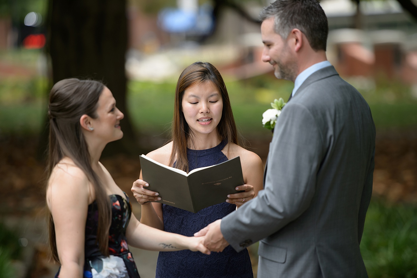 Mikkel Paige Photography's wedding photos - an elopement in downtown Raleigh, North Carolina - with a white bouquet by @meristemfloral, beauty by Wink Hair and Makeup and photos by Brian Mullins Photography.