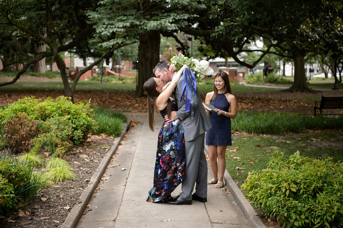 Mikkel Paige Photography's wedding photos - an elopement in downtown Raleigh, North Carolina - with a white bouquet by @meristemfloral, beauty by Wink Hair and Makeup and photos by Brian Mullins Photography.