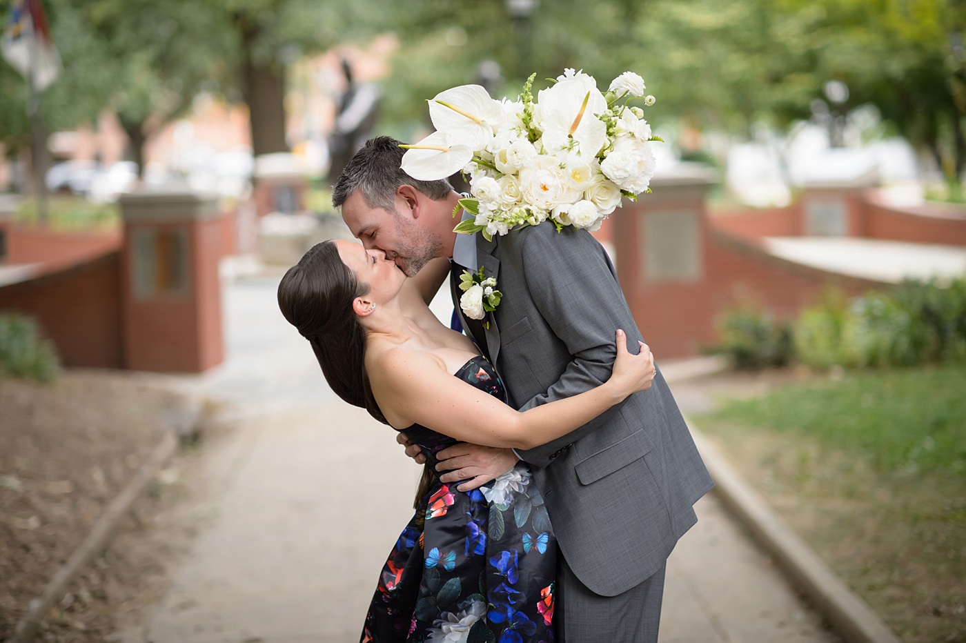 Mikkel Paige Photography's wedding photos - an elopement in downtown Raleigh, North Carolina - with a white bouquet by @meristemfloral, beauty by Wink Hair and Makeup and photos by Brian Mullins Photography.