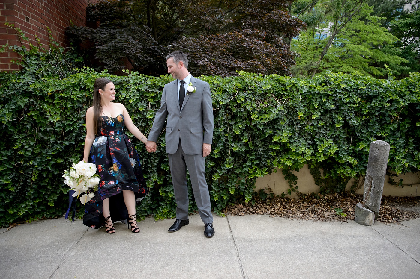 Mikkel Paige Photography's wedding photos - an elopement in downtown Raleigh, North Carolina - with a white bouquet by @meristemfloral, beauty by Wink Hair and Makeup and photos by Brian Mullins Photography.