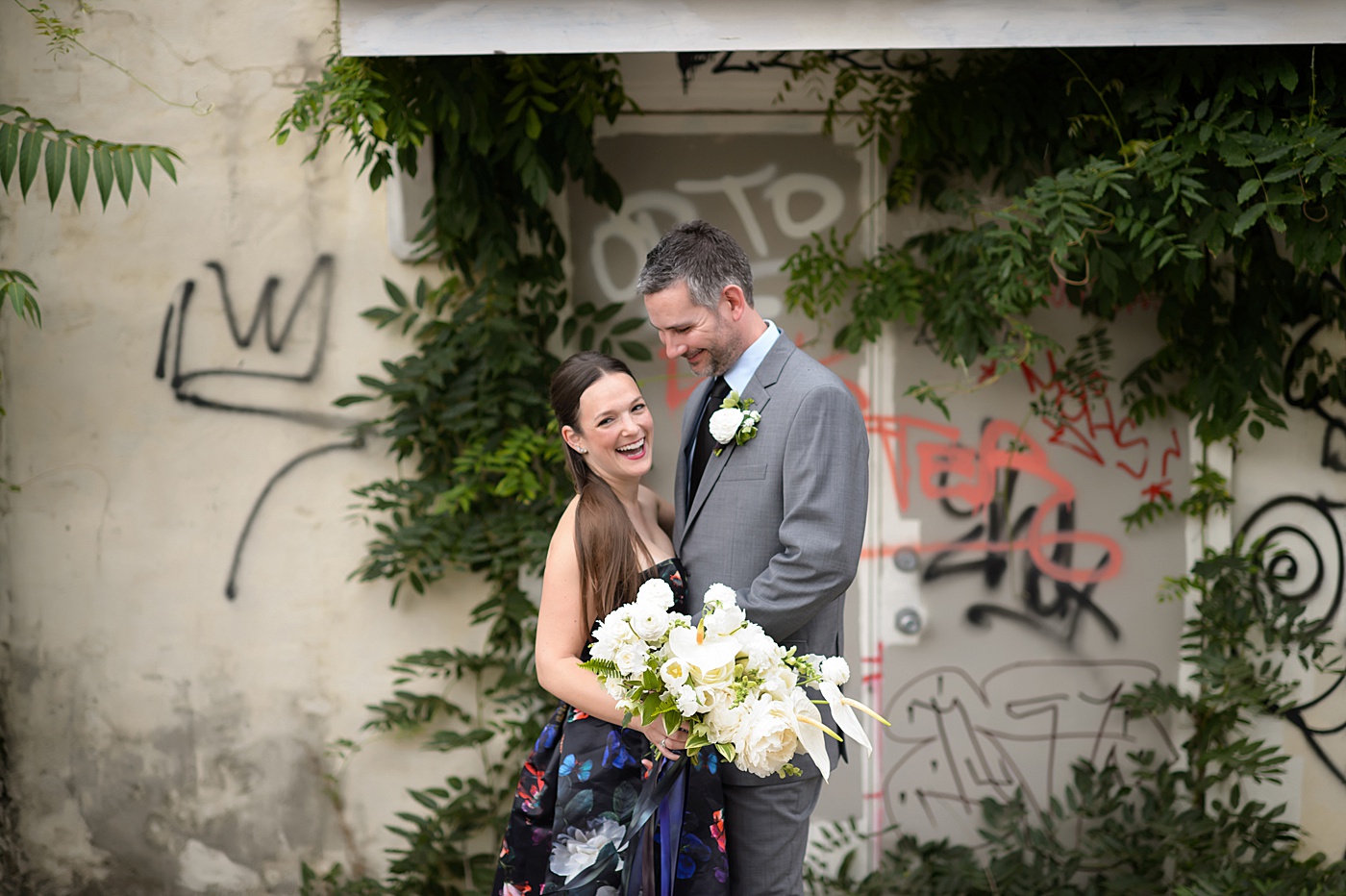 Mikkel Paige Photography's wedding photos - an elopement in downtown Raleigh, North Carolina - with a white bouquet by @meristemfloral, beauty by Wink Hair and Makeup and photos by Brian Mullins Photography.