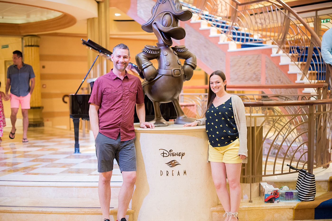 Sometimes Home travel blog owners, Dan and Mikkel, aboard the Disney Dream with Disney Cruise Line. Mikkel was there to photograph a DCL wedding! #SometimesHome #DisneyCruiseLine #DisneyDream