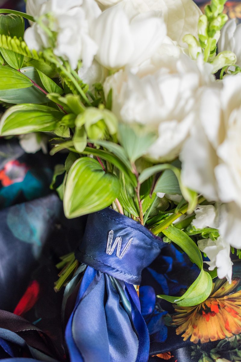 Detail photos of wedding elements by Mikkel Paige Photography, of a custom bouquet wrap she made with hand dyed silk ribbons and crystal quartz points. #MikkelPaige #Crystals #Quartz #weddingbouquet