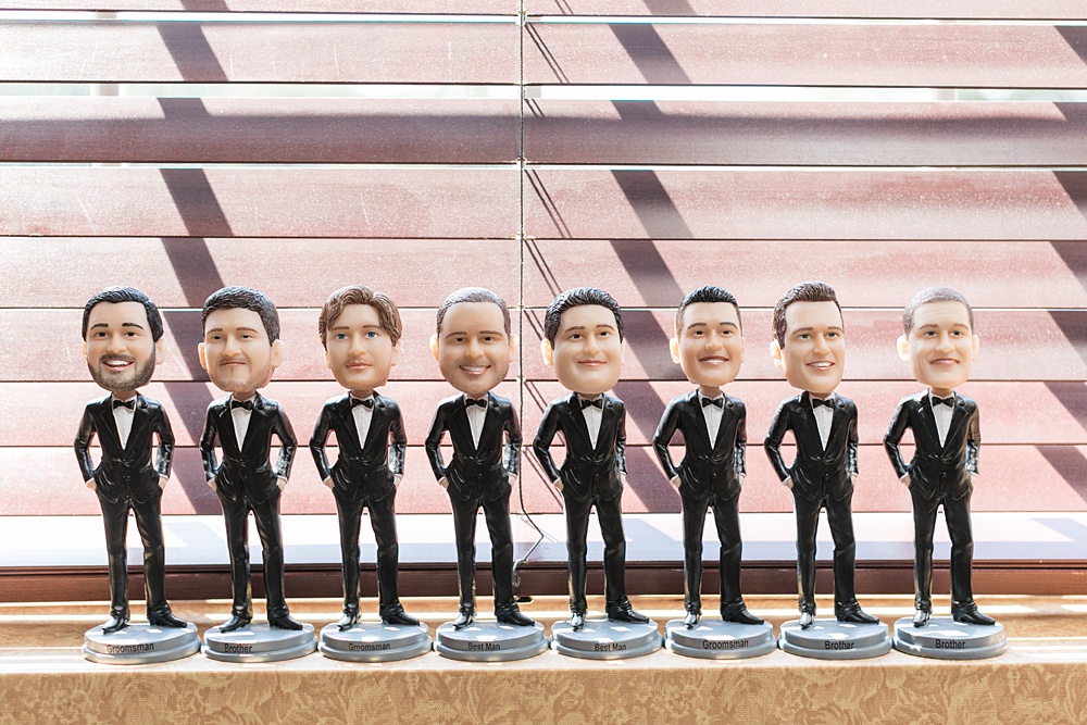 Photos of bobble heads for the groomsmen gifts the groom gave them for his East Wind wedding on Long Island. Pictures by Mikkel Paige Photography, New York wedding photographer. #mikkelpaige #groomsmen #weddinggifts #bobbleheads