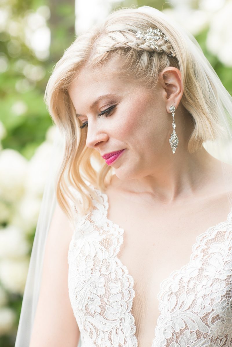 Photos of the bride with short hair and a braid by Mikkel Paige Photography at an East Wind wedding in Wading River, NY on Long Island. The wedding venue has a beautiful outdoor ceremony area and pretty indoor reception space. #mikkelpaige #newyorkweddingphotographer #longislandweddingvenue #summerbride #laceweddinggown #bridestyle