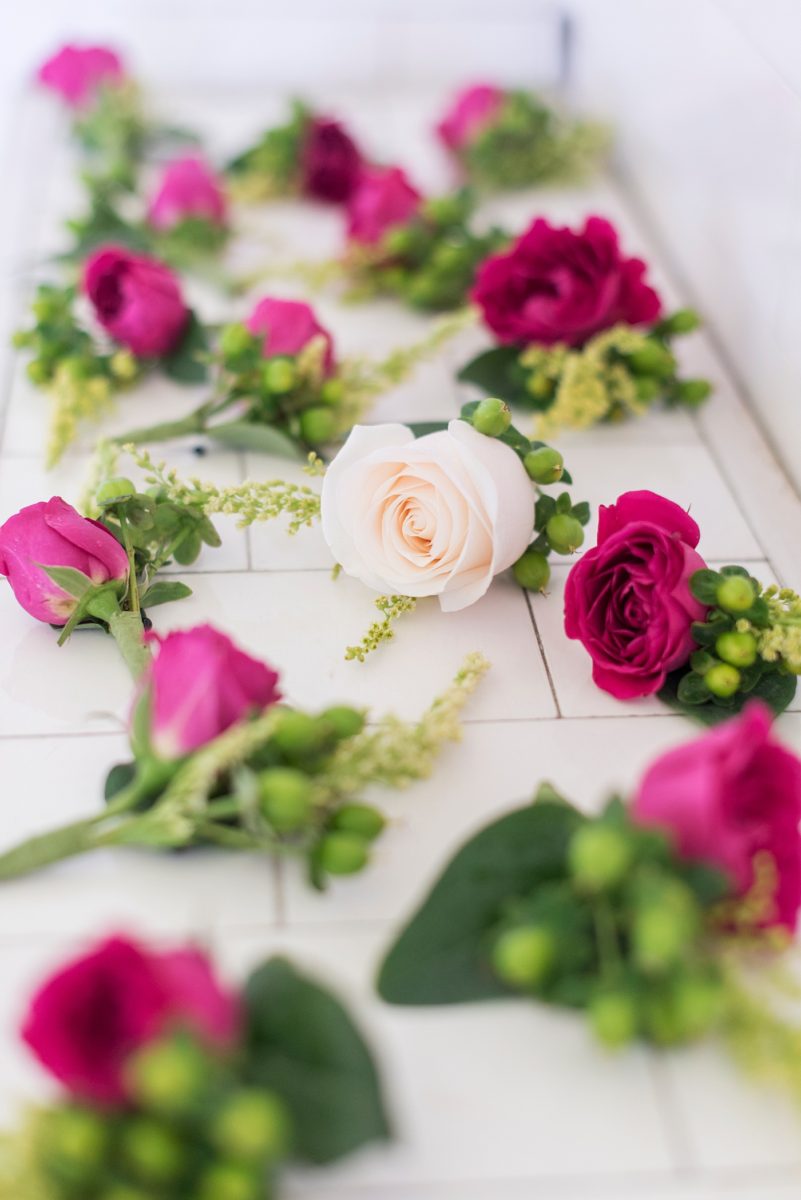 Detail wedding picture of pink and white boutonnieres at Waveny House venue in New Canaan, CT by Mikkel Paige Photography. A September wedding with a beautiful couple in a picturesque park setting! #mikkelpaige #weddinginvitation #connecticutweddingvenue #CTwedding #CTweddingphotographer #boutonnieres