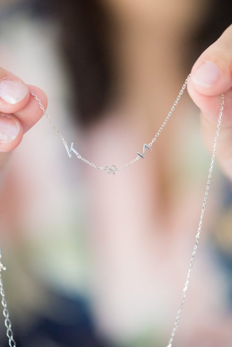 The bride gifted her bridesmaids custom initial necklaces for her wedding at Crabtree's Kittle House in Chappaqua, New York. Photos by Mikkel Paige Photography. This venue in Westchester County is near the Hudson Valley and NYC. #mikkelpaige #hudsonvalleyweddings #crabtreeskittlehouse #fallwedding #westchestervenues #weddingday #detailphotos #weddingdetails #bridesmaidsgifts