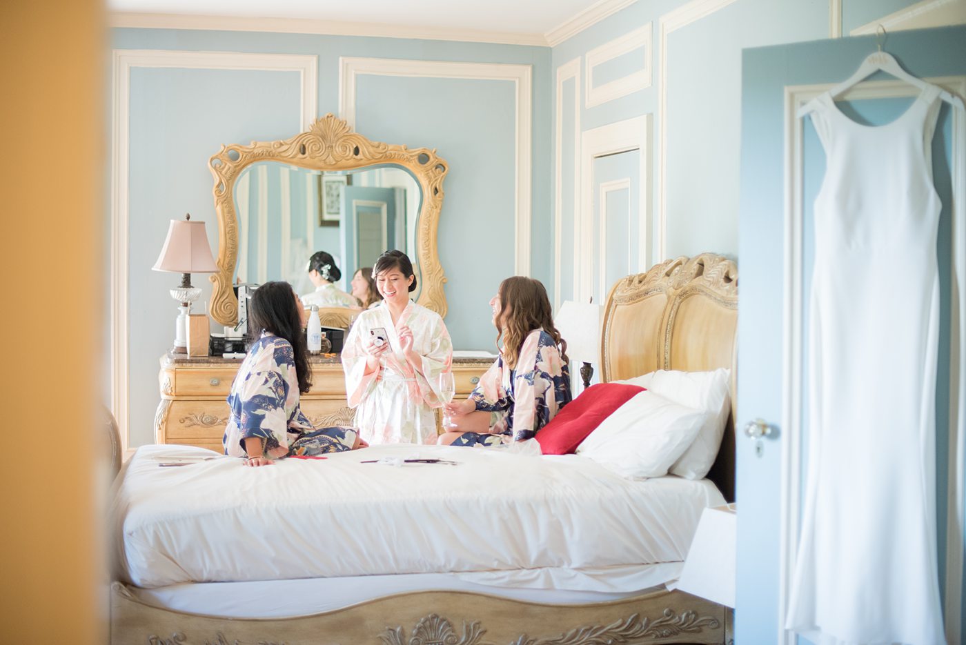 The bride and her bridesmaids and flower girl got ready for her wedding at Crabtree's Kittle House in Chappaqua, New York at the boutique hotel. Photos by Mikkel Paige Photography. This venue in Westchester County is near the Hudson Valley and NYC. She wore an elegant, form-fitting white gown with open back with her hair braided and in a low bun. #mikkelpaige #hudsonvalleyweddings #crabtreeskittlehouse #fallwedding #westchestervenues #bridestyle #filipinobride #gettingready #weddingday